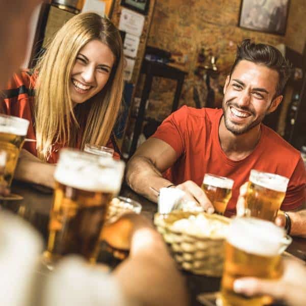 A group of friends enjoying food and drinks.